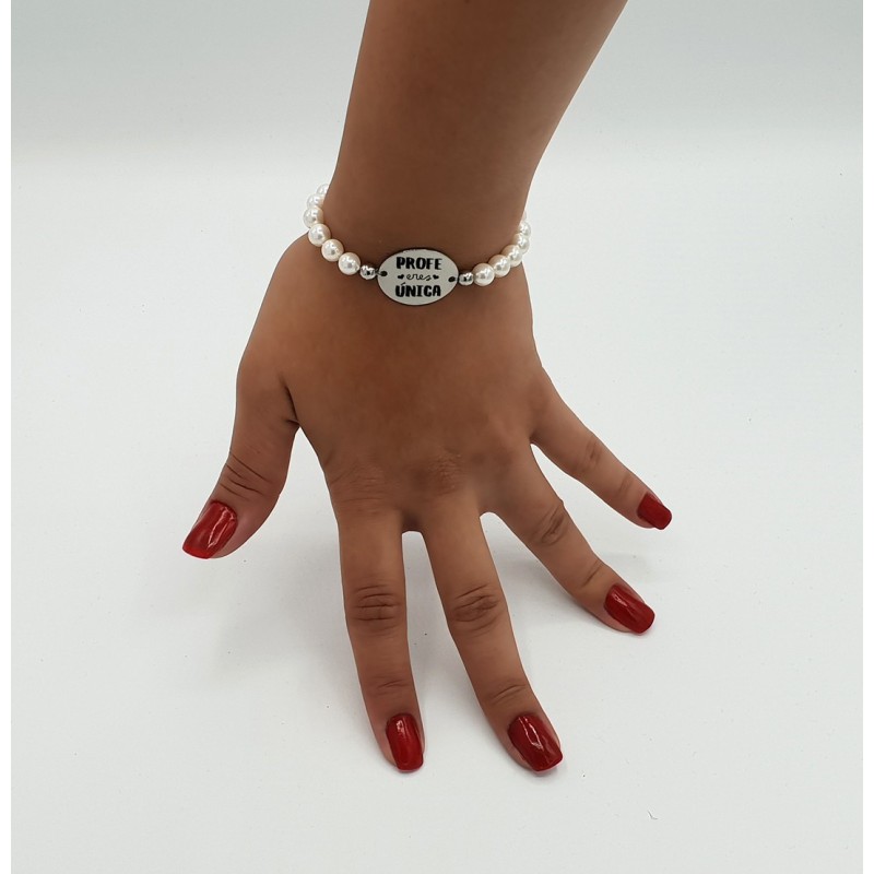 Pulsera ORIGEN, con frase (Profe eres única) elástica.