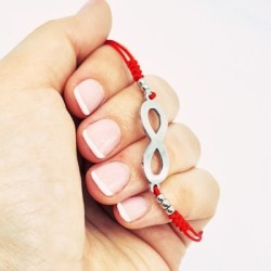 Pulsera modelo INFINITO, con finales de acero, cordón de nylon.