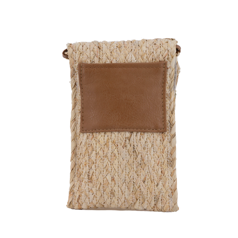 Bolso móvil trenzado Simó Sastre, modelo Nicole, colección yute 2025.